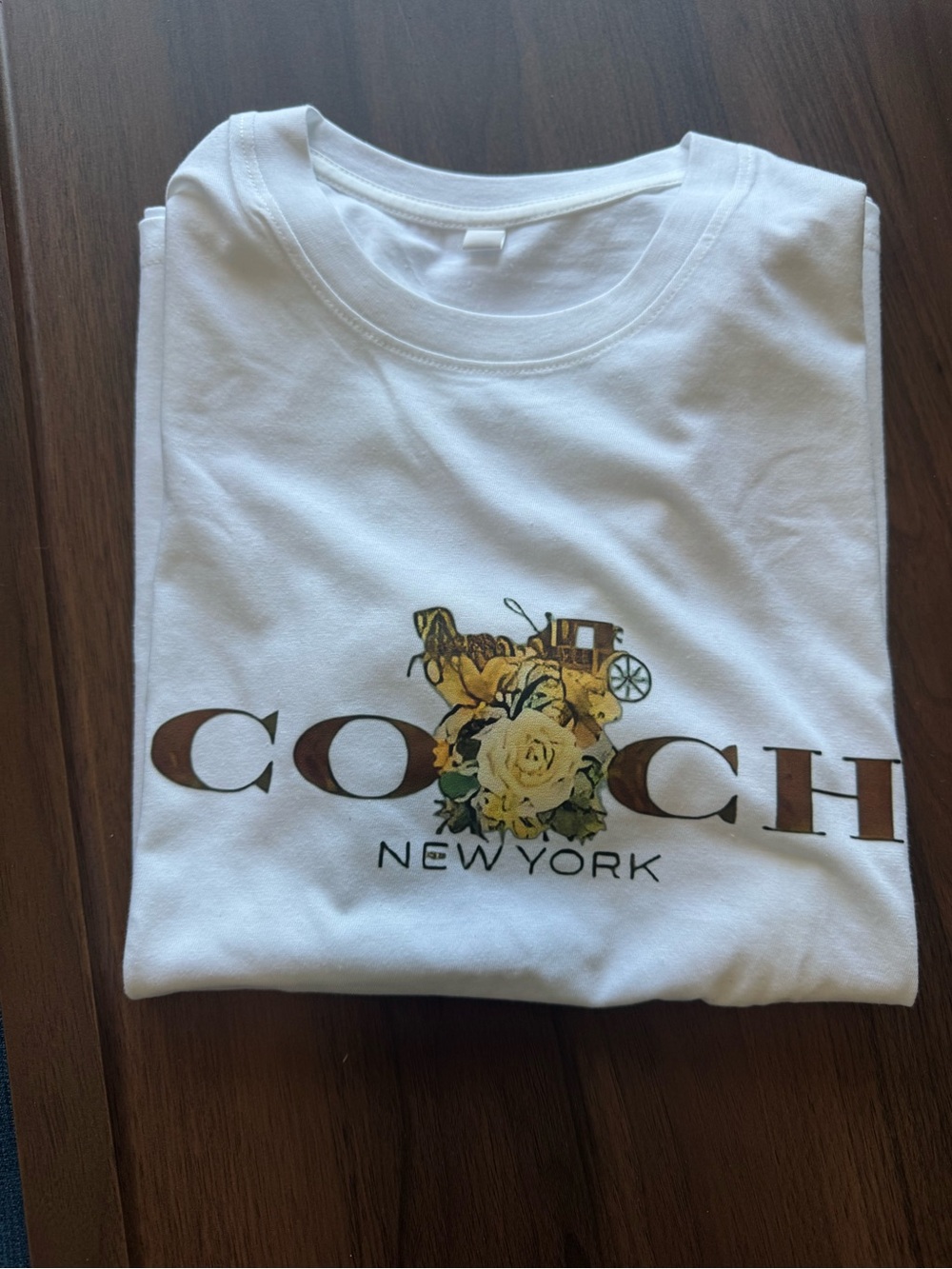 Woman’s White Short-Sleeve Tee with Brown Logo and Yellow Floral